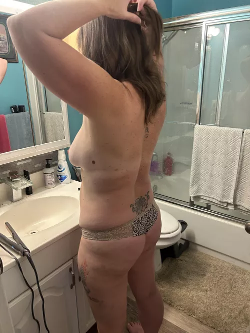 She is doing her hair 