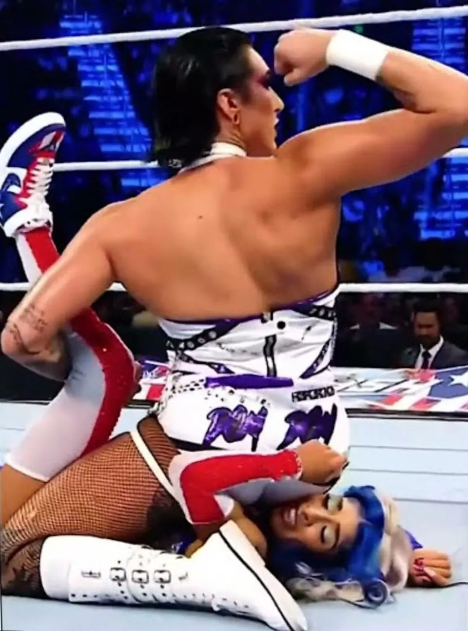 Rhea’s buttcheek nearly covering Zelina’s entire face
