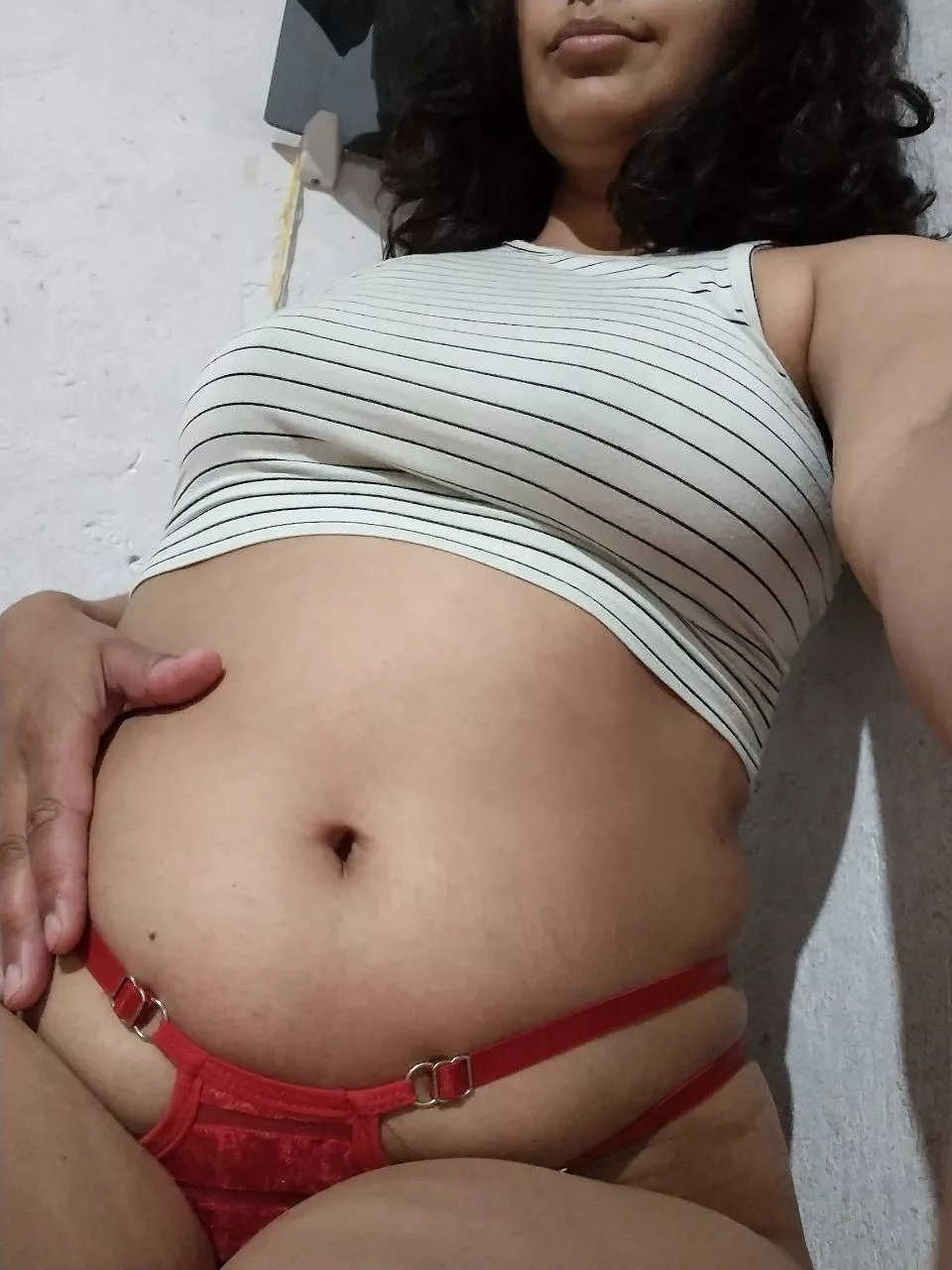 Sitting on my bed caressing my belly, would you like to join me?