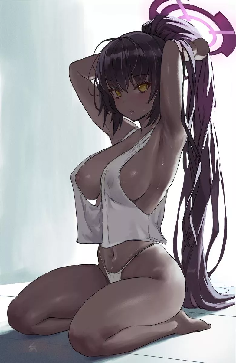 Casually tying her hair