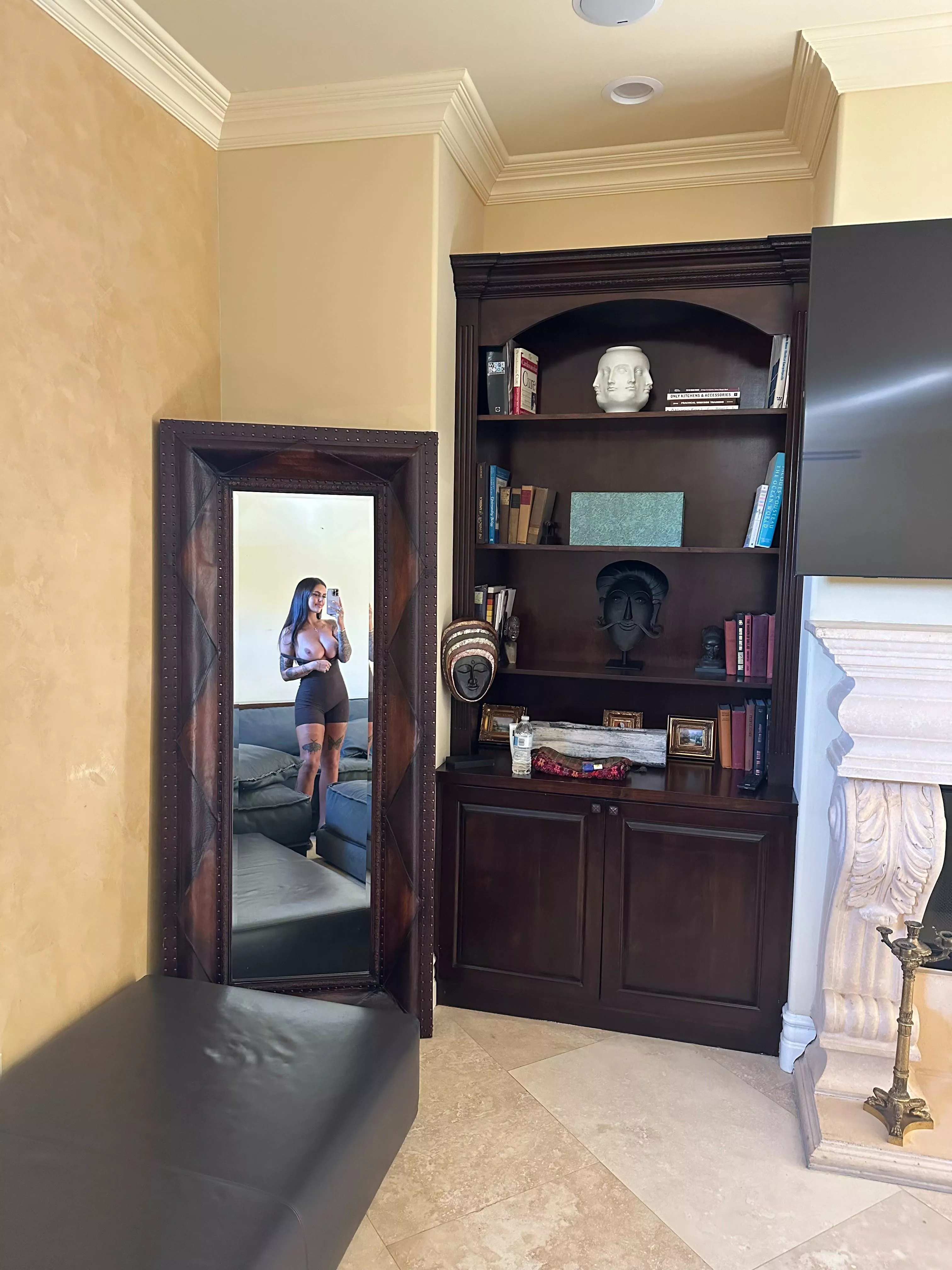 Mommy's tempting you to suck on her milkers