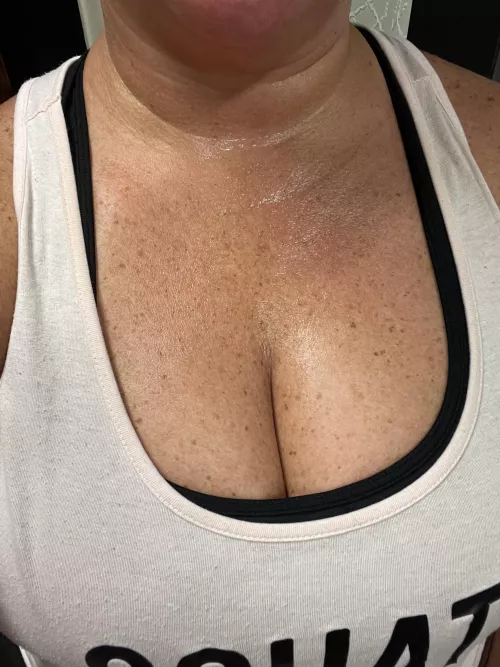 Sweat is glistening on this chest. 