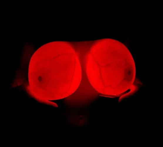Big glowing implants in the dark