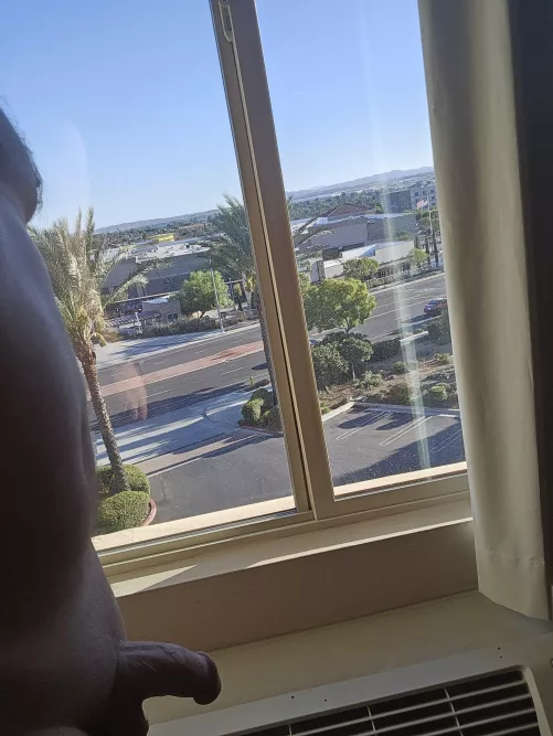 Suitcase unpacked, drink made, windows open, clothes off