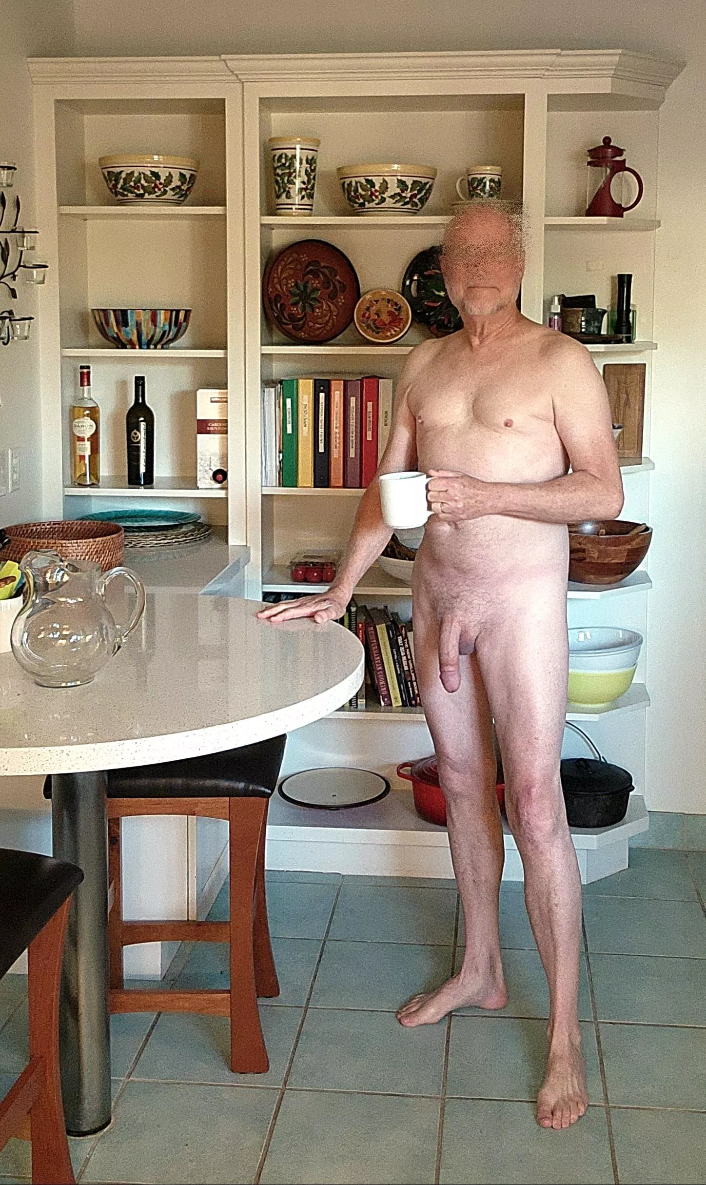 Washing the dishes and making coffee. Always naked unless it's just too cold.
