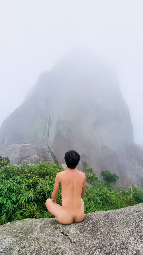 At a huge rock on the mountain peak