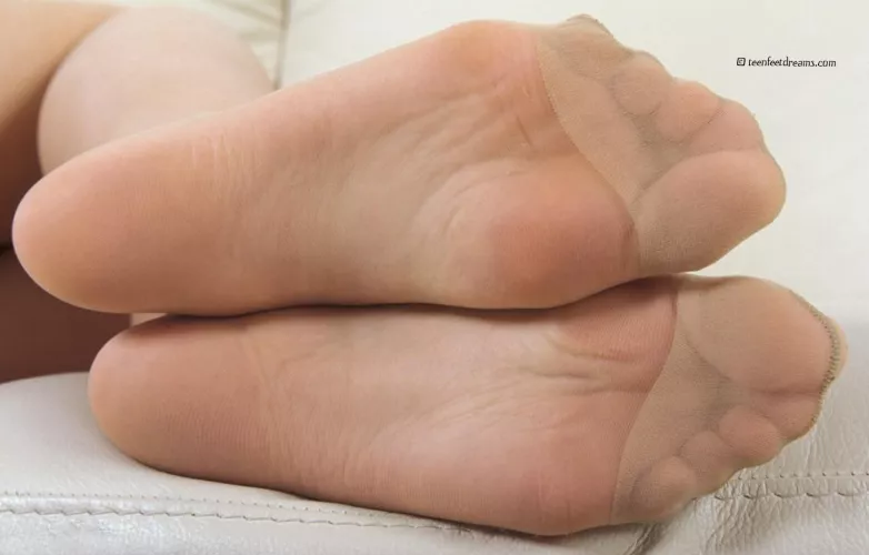 Close-up of Aneta's soles in sweaty nylon pantyhose
