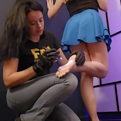 Shoes and socks off, inspecting toes for contraband 