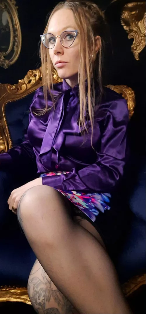 Strict teacher in purple satin ready to punish bad students