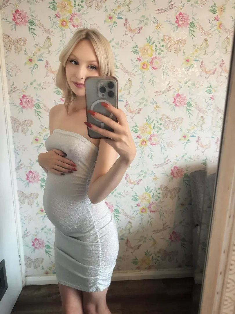 I love how this dress hugs my little bump 