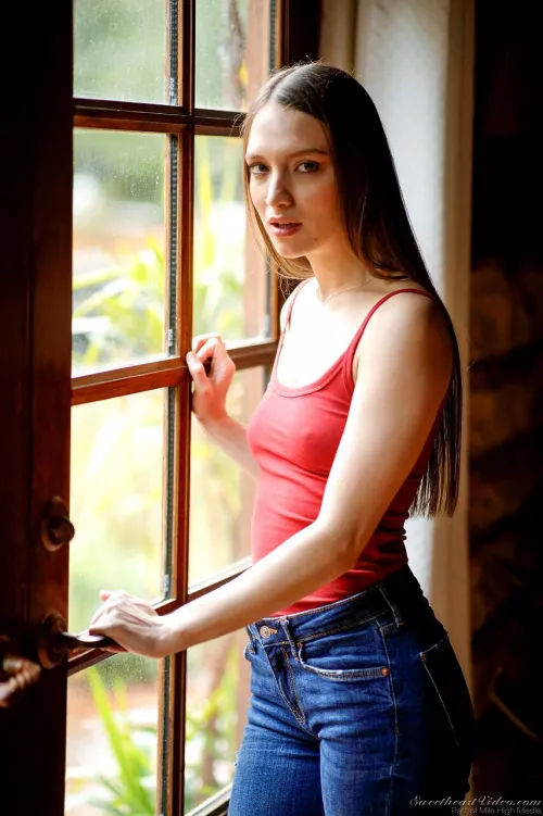 Cute in jeans and tank top.