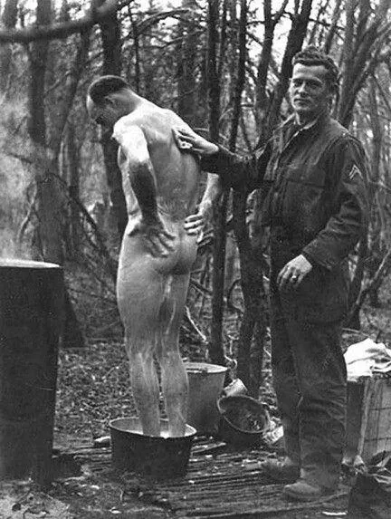 WW2 getting a back wash from a buddy.
