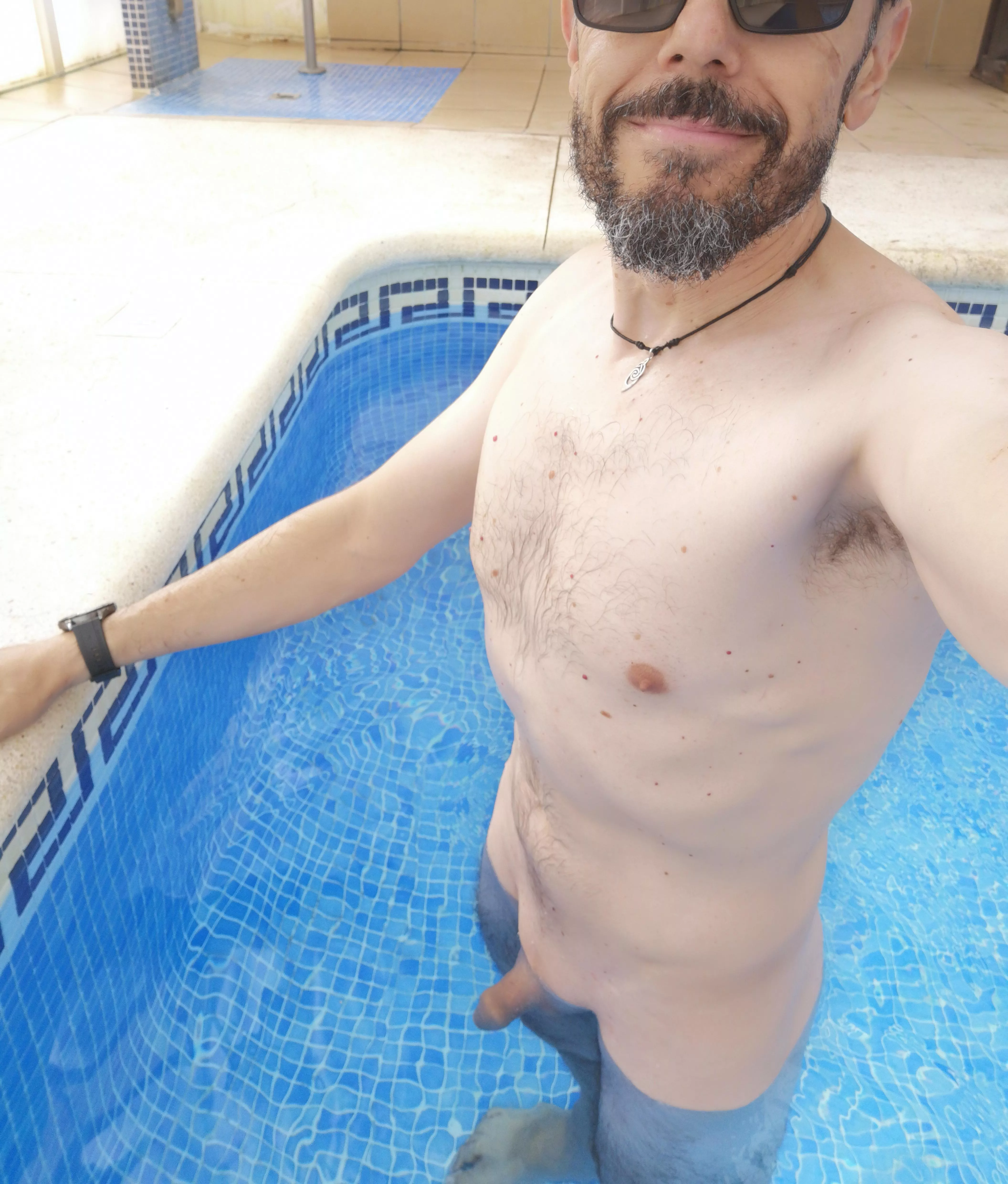 Enjoying the swimming pool naked, a couple of inches inside the water is not enough (m) 