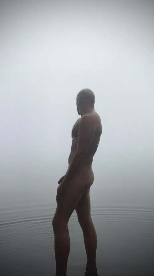 Foggy Autumn morning cold dip in the lake. 