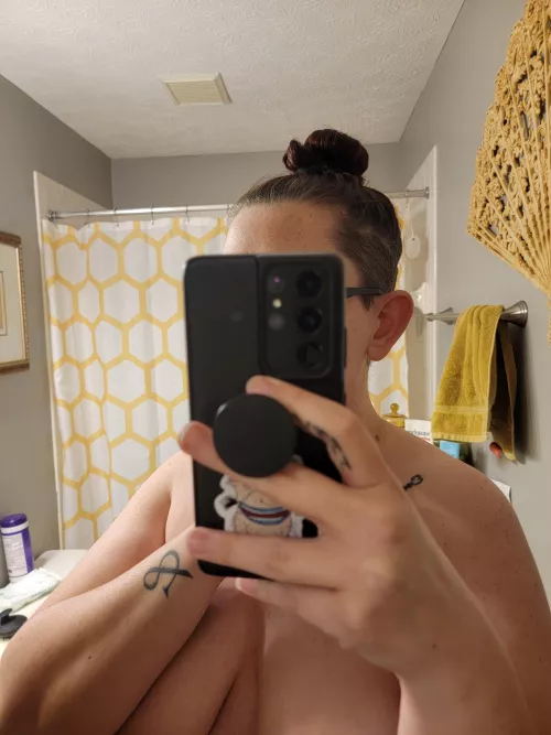 Tiny topknot, undercut growth, and some salt & pepper