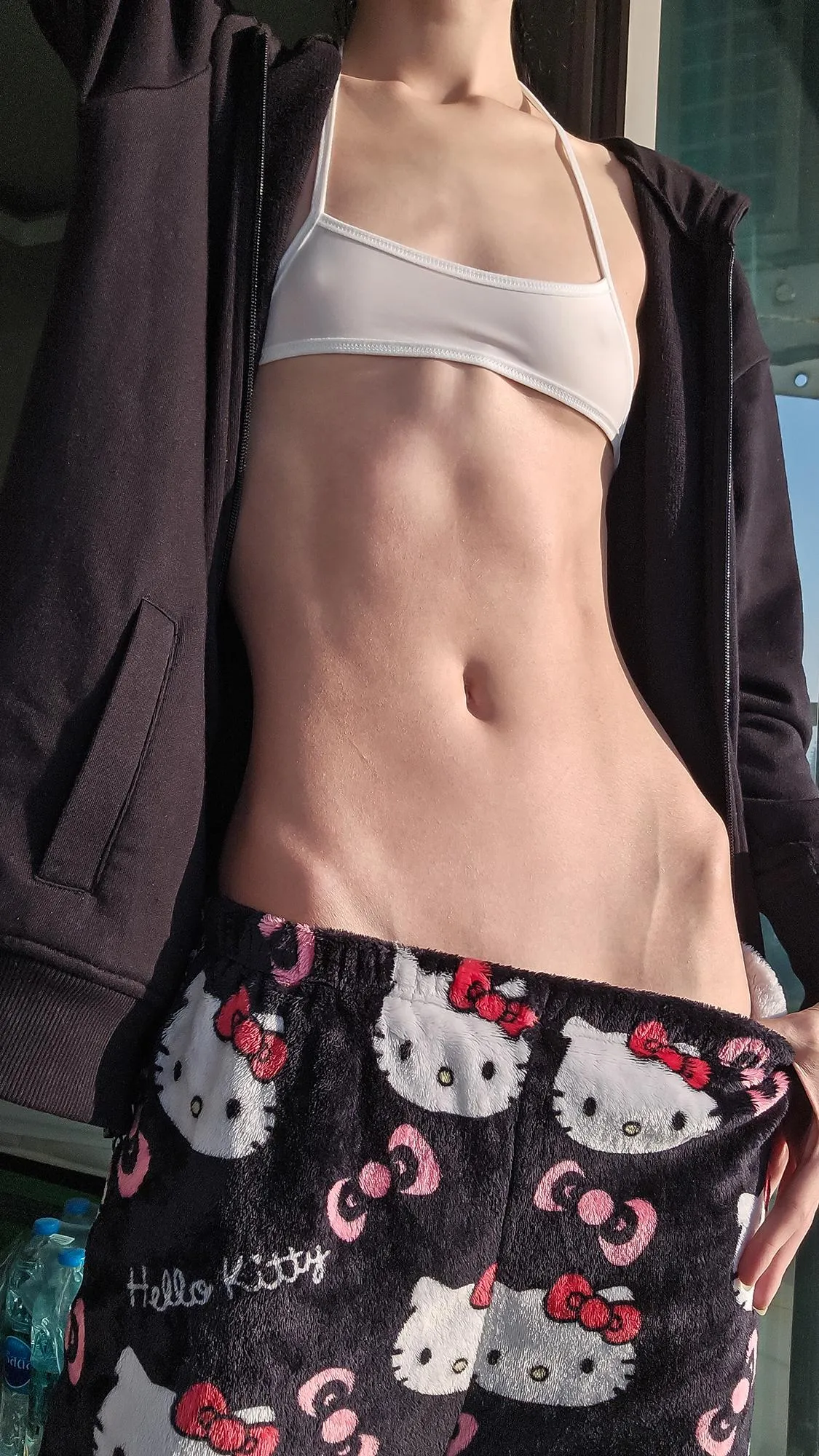 Hipbones in the pre-sunset sunlight