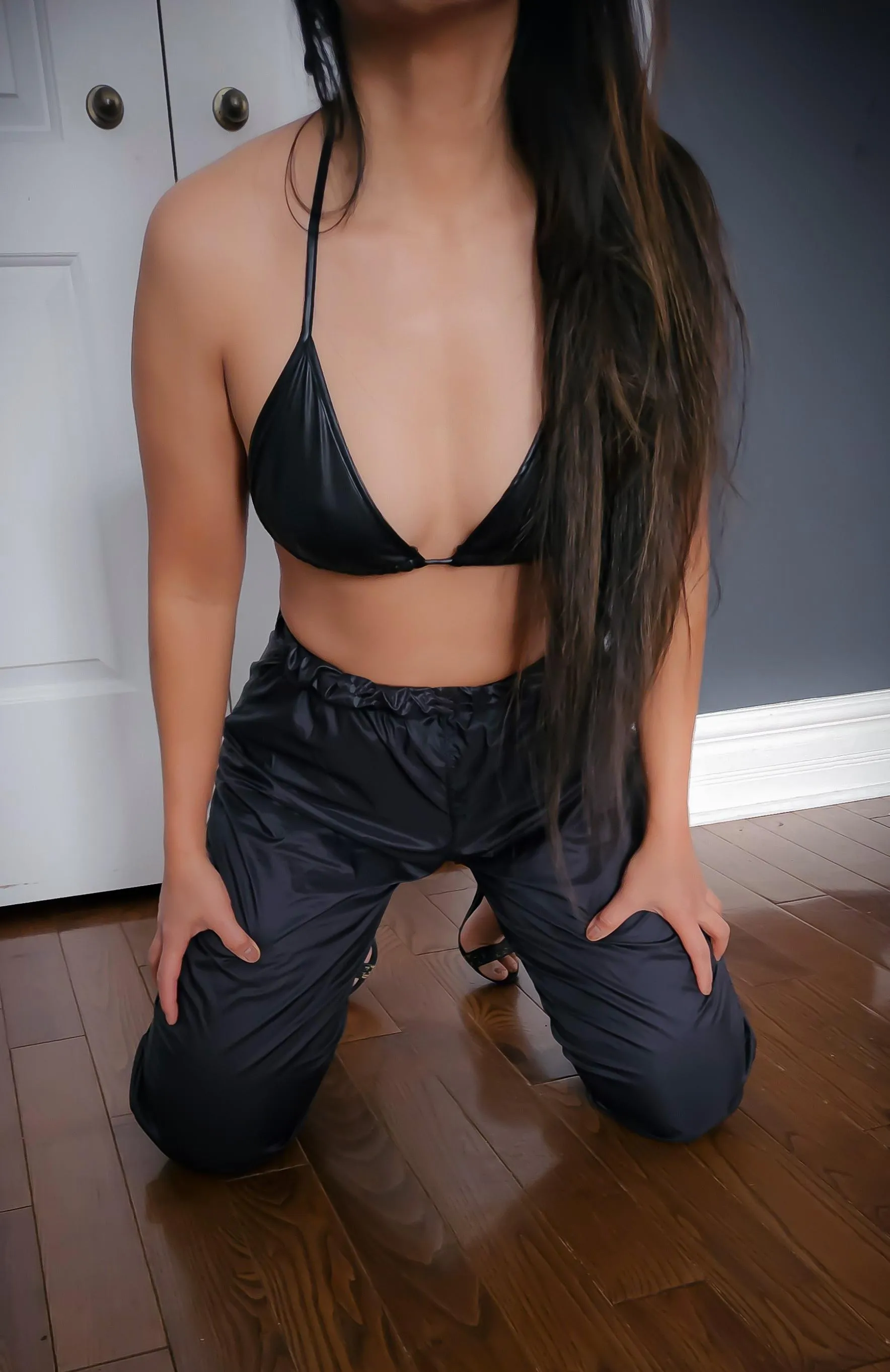 Wetlook in black nylon pants