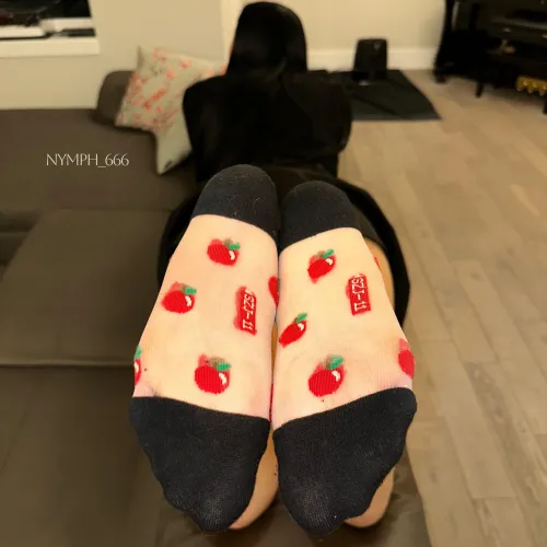 Goth girl teasing her semi-sheer socks.