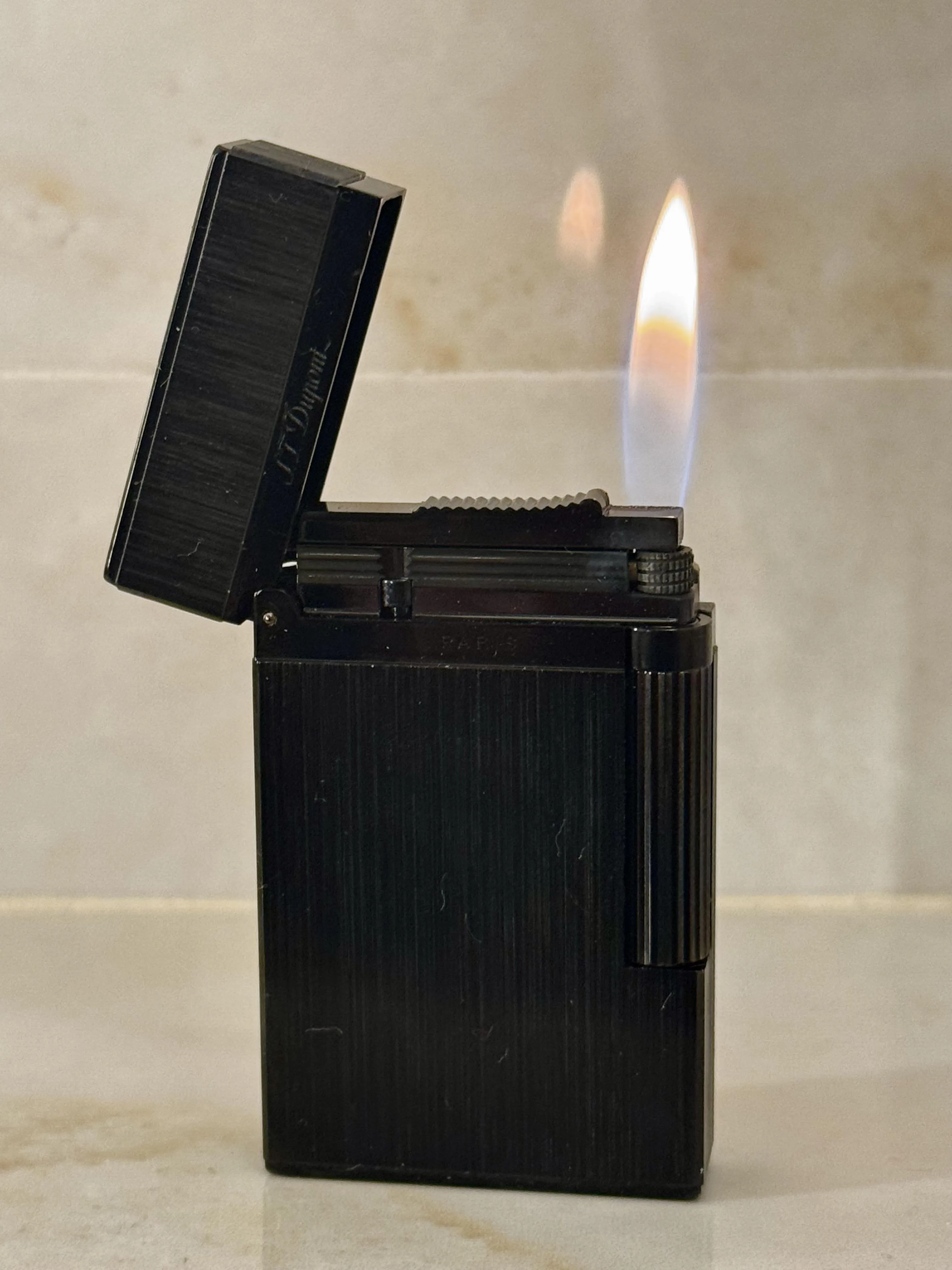 Knock off S T Dupont soft flame lighter bought for a fraction of the real price. Looks and feels just as good as the original, frightening how good these are!