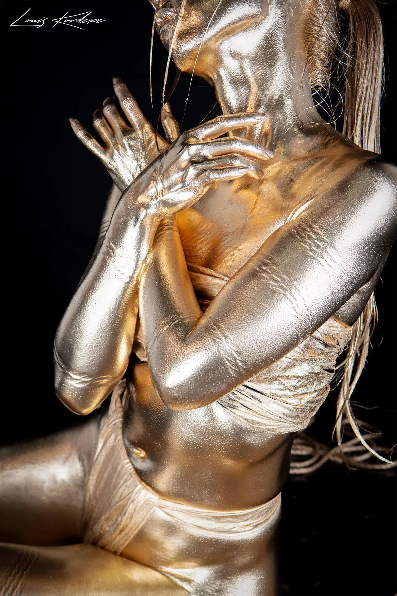 Gold dust body paint with shibari rope marks.