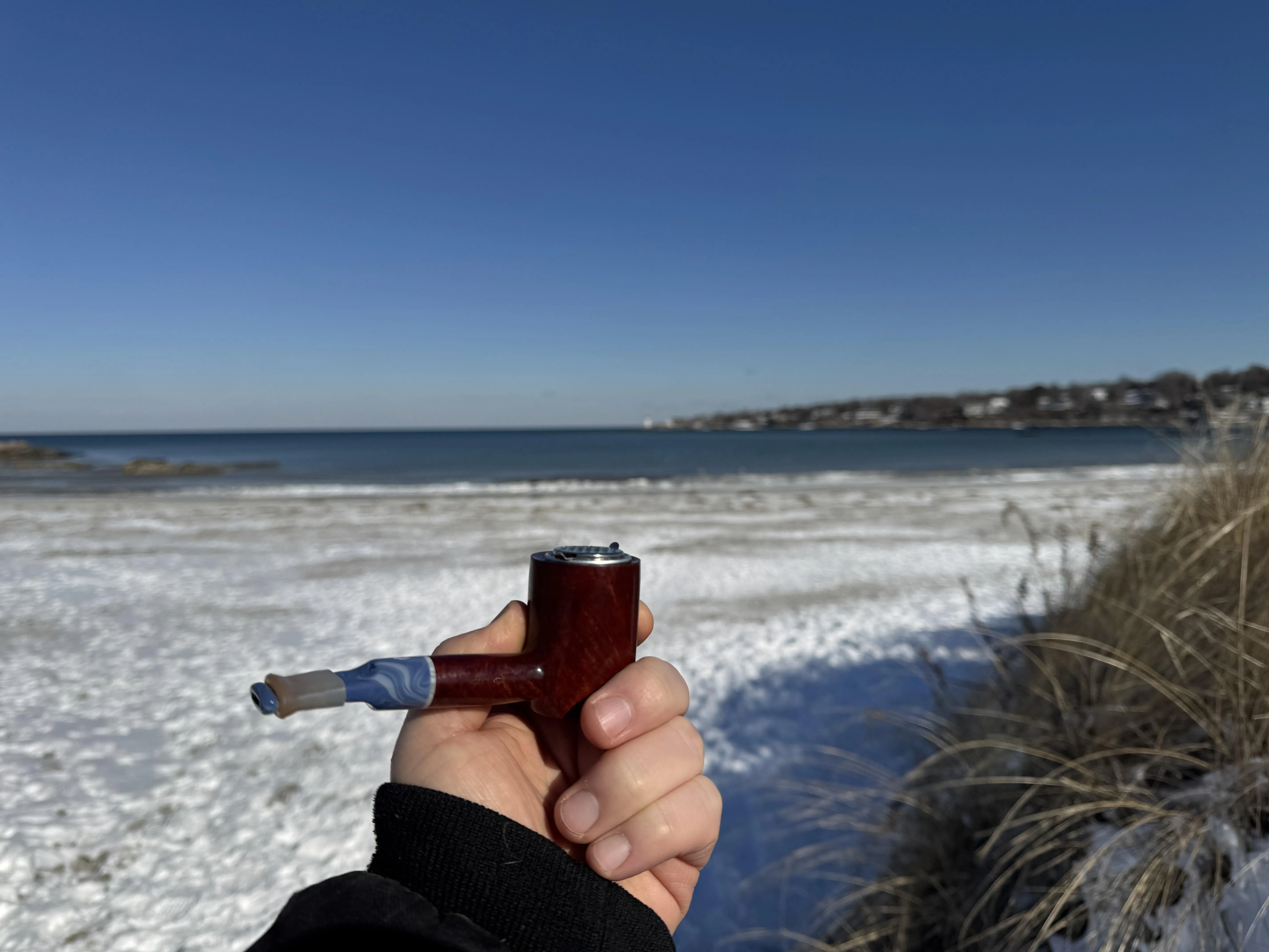 Beautiful day for a pipe on a winter beach walk.