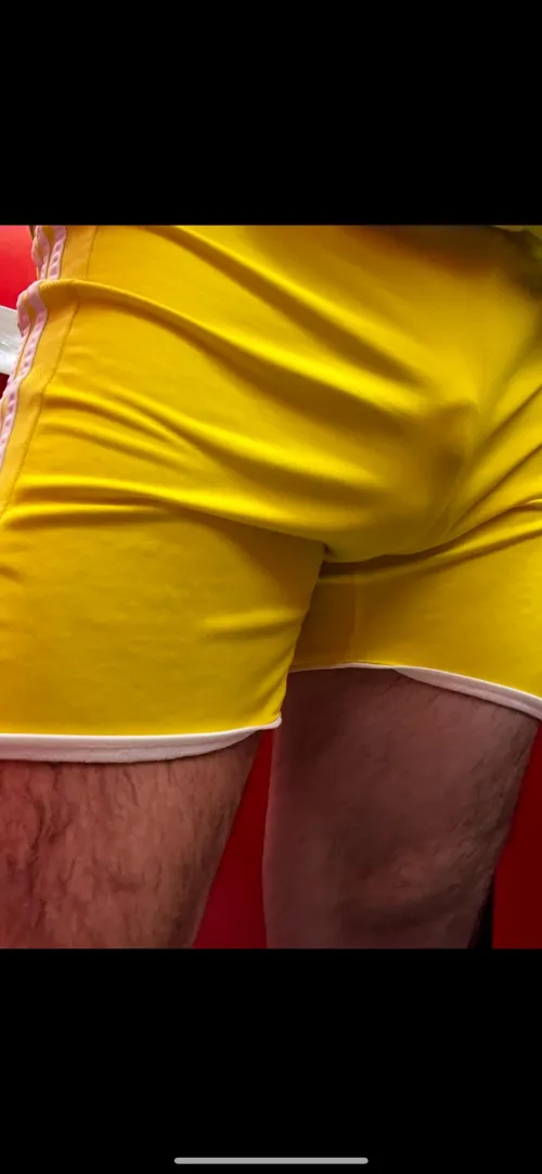 Freeballing in tight yellow shorts