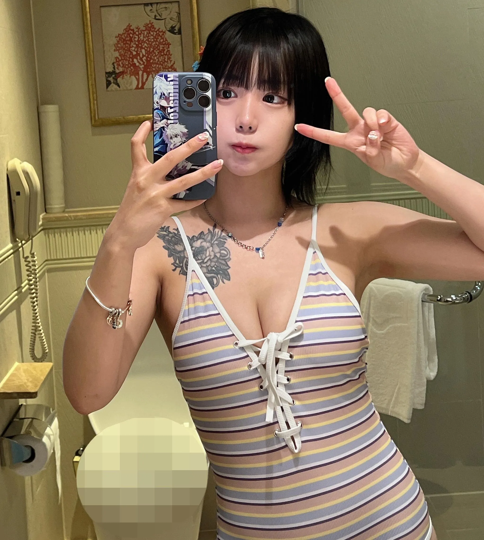 Asian Cutie in a striped onesie