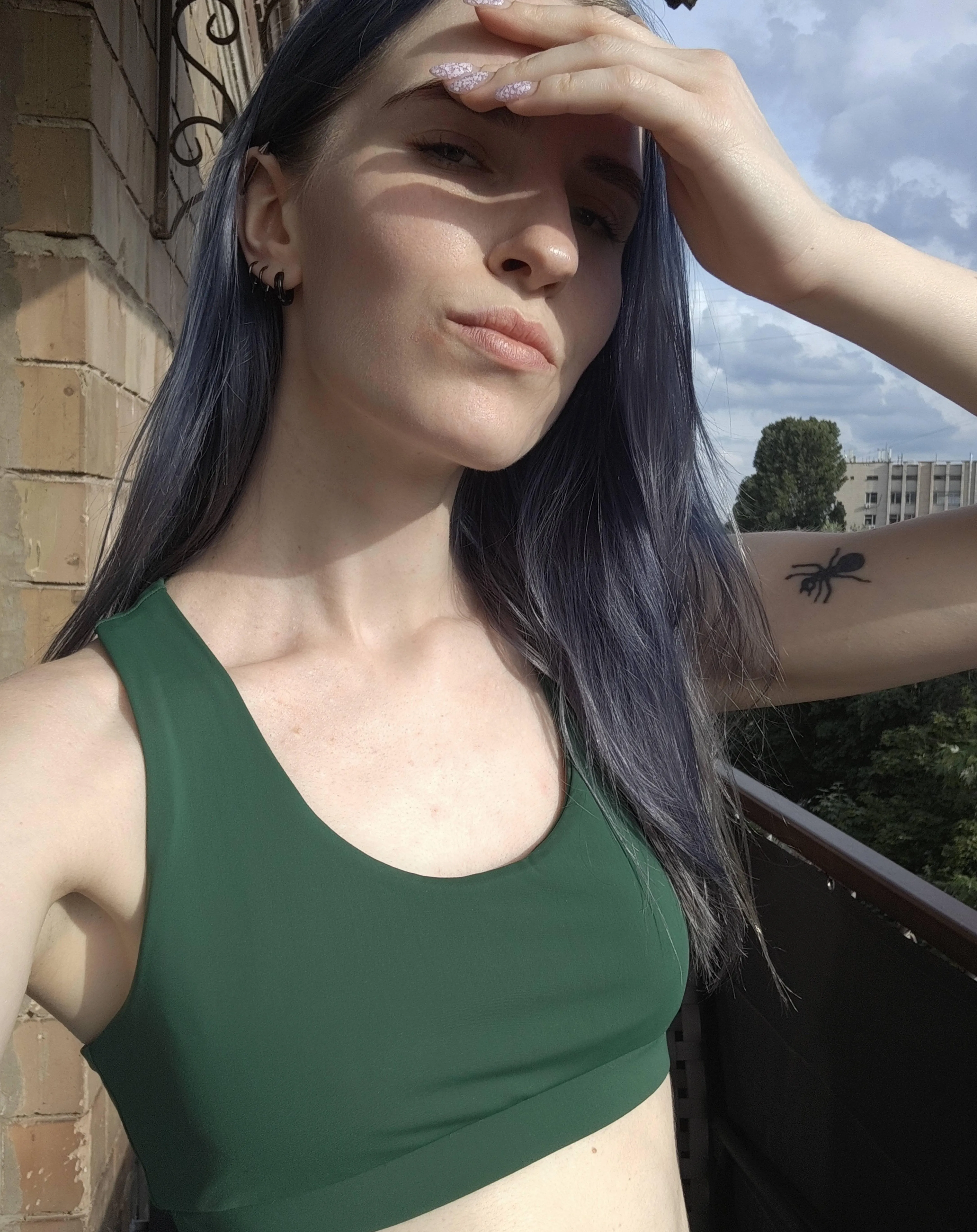 young girl taking selfies on the balcony