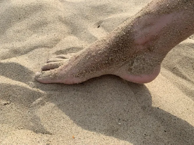 Sand covered foot