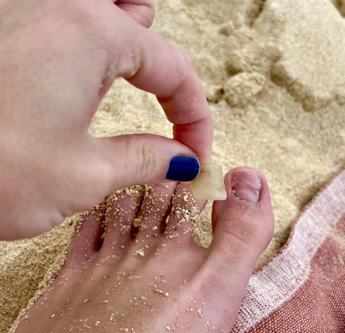 My toenail started to fall off in the ocean, I came in to shore and pried it all the way off
