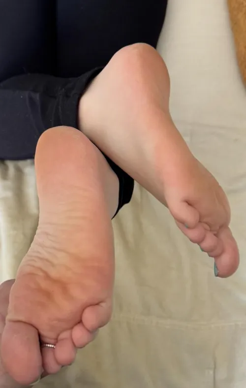 Wife’s crossed feet.