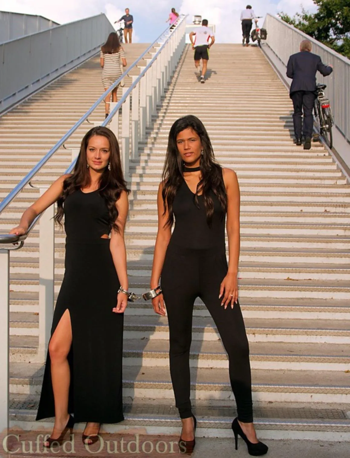 Dressed in black and cuffed together