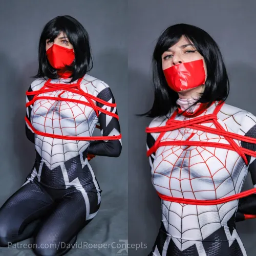 The great thing about superheroes wearing masks is that they hide gags very well. Just ask Silk here - you won't get much of an answer other than 