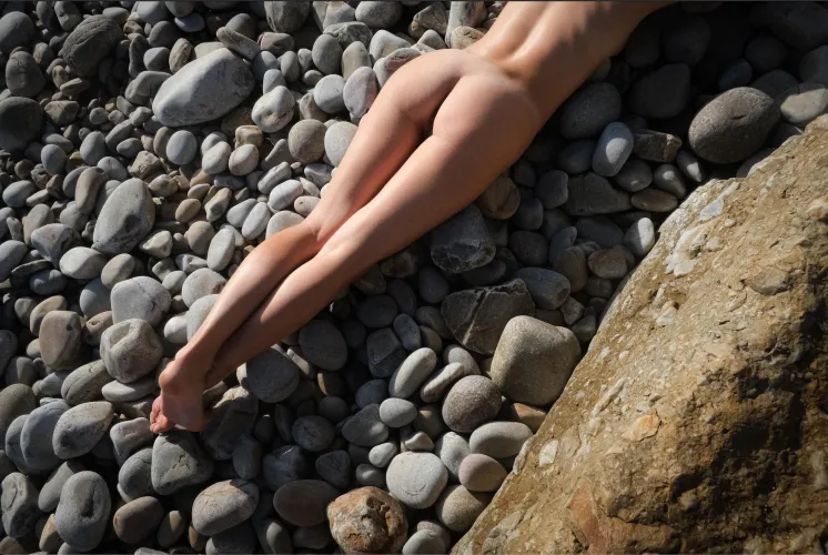 Enjoying the sun on a pebble beach