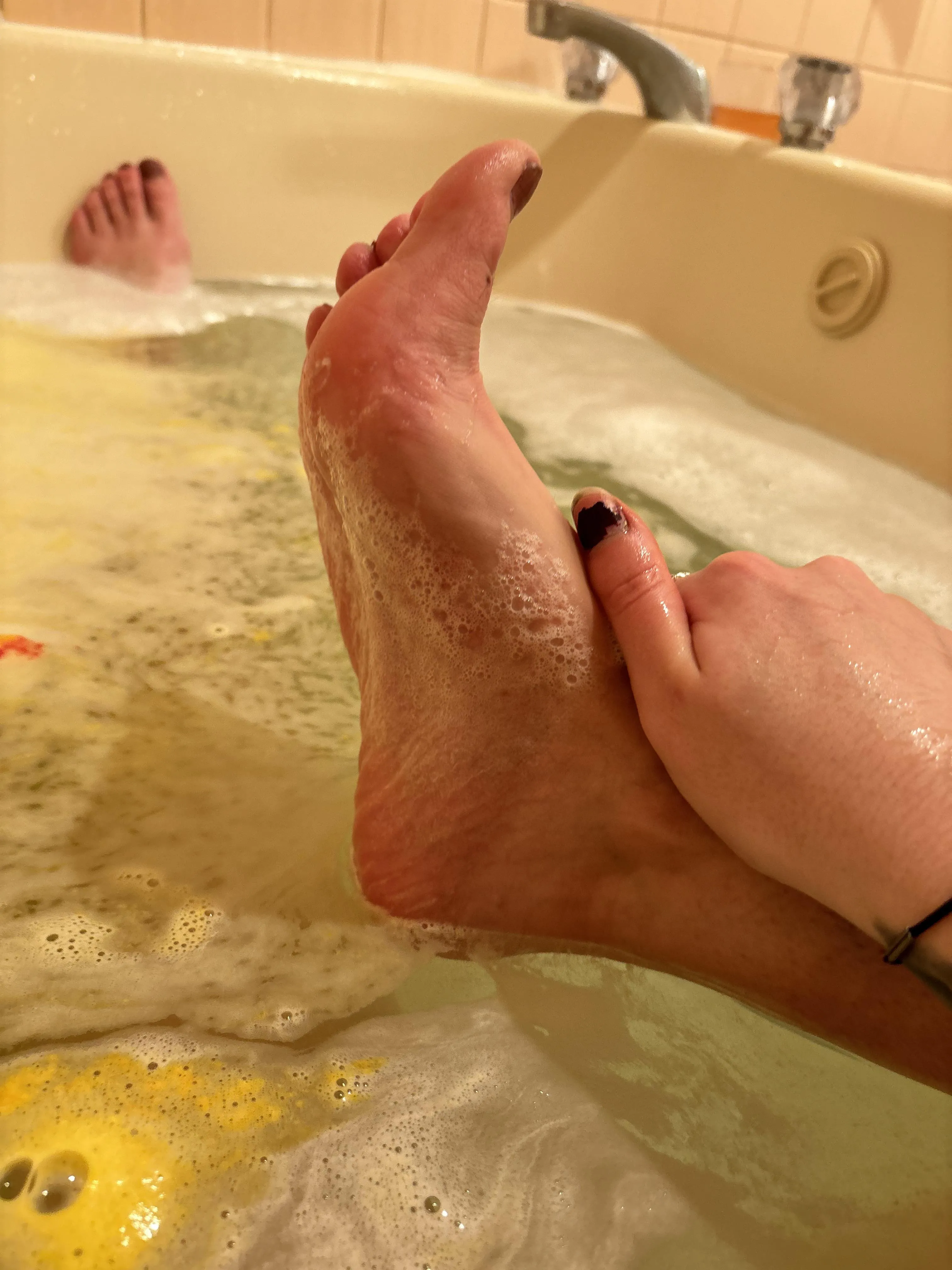 Playing with my feet in the tub