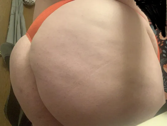 A peach in red string