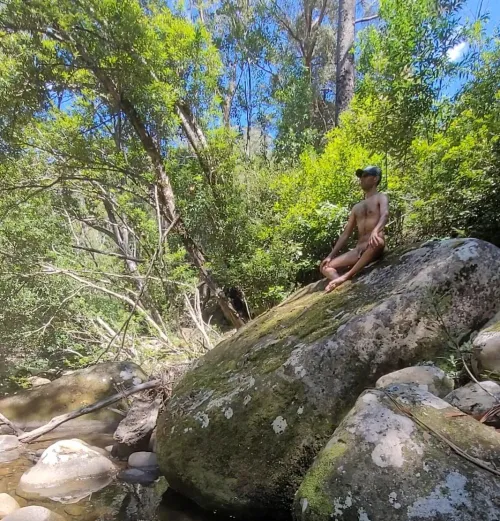 Enjoying nature perched on a boulder