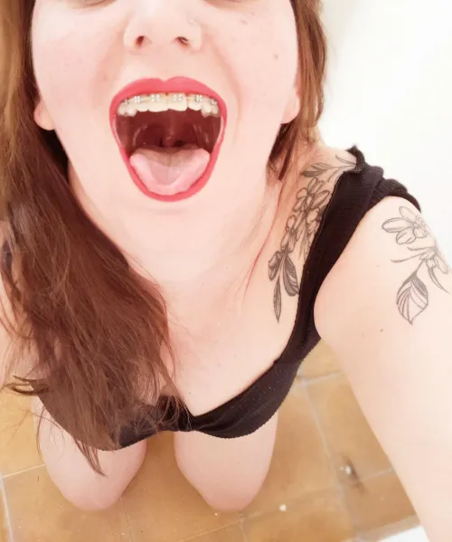 Look how deep that throat looks and how shiny my arms are.