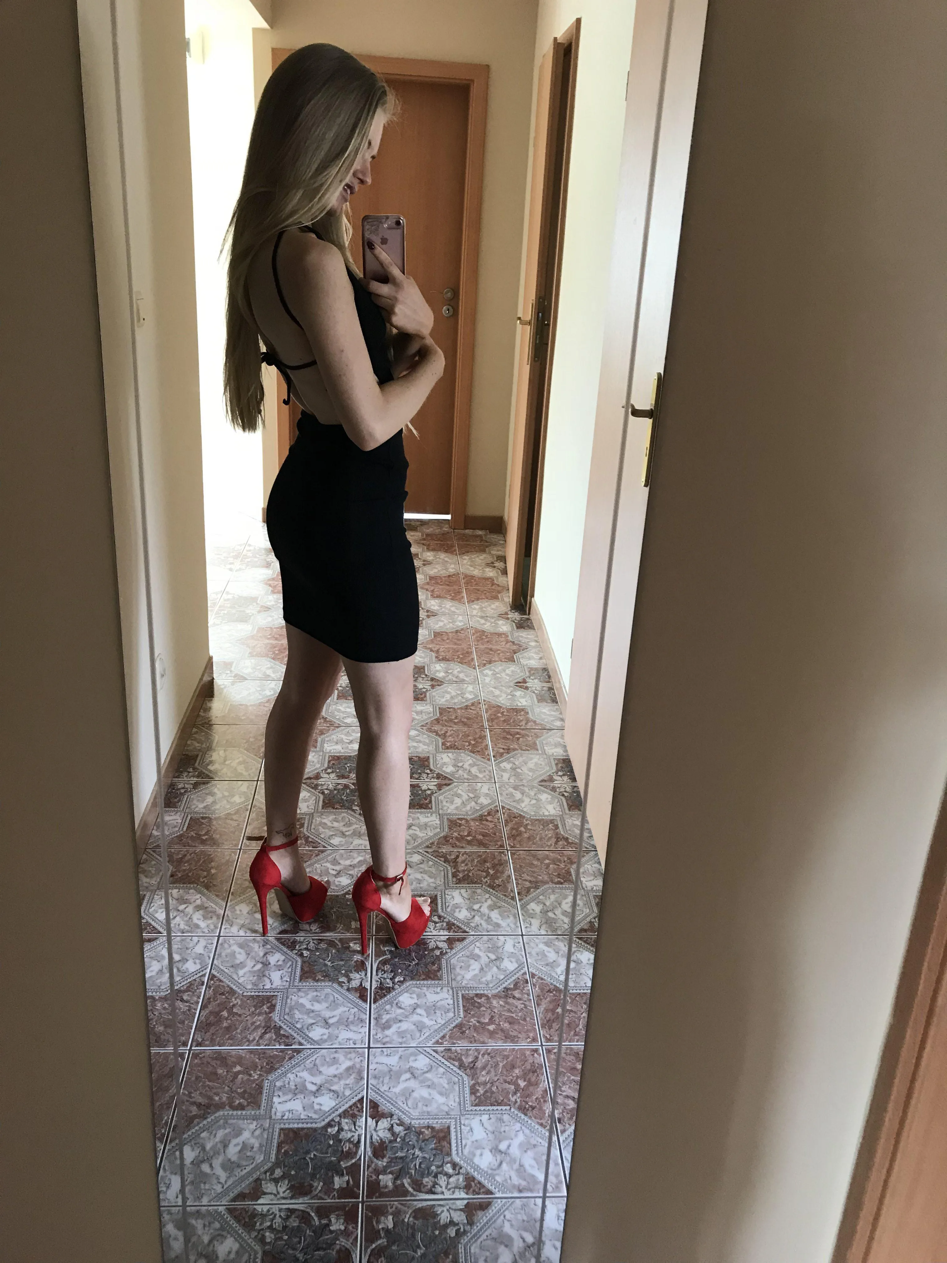 Red heels and long sexy legs bring joy into your life