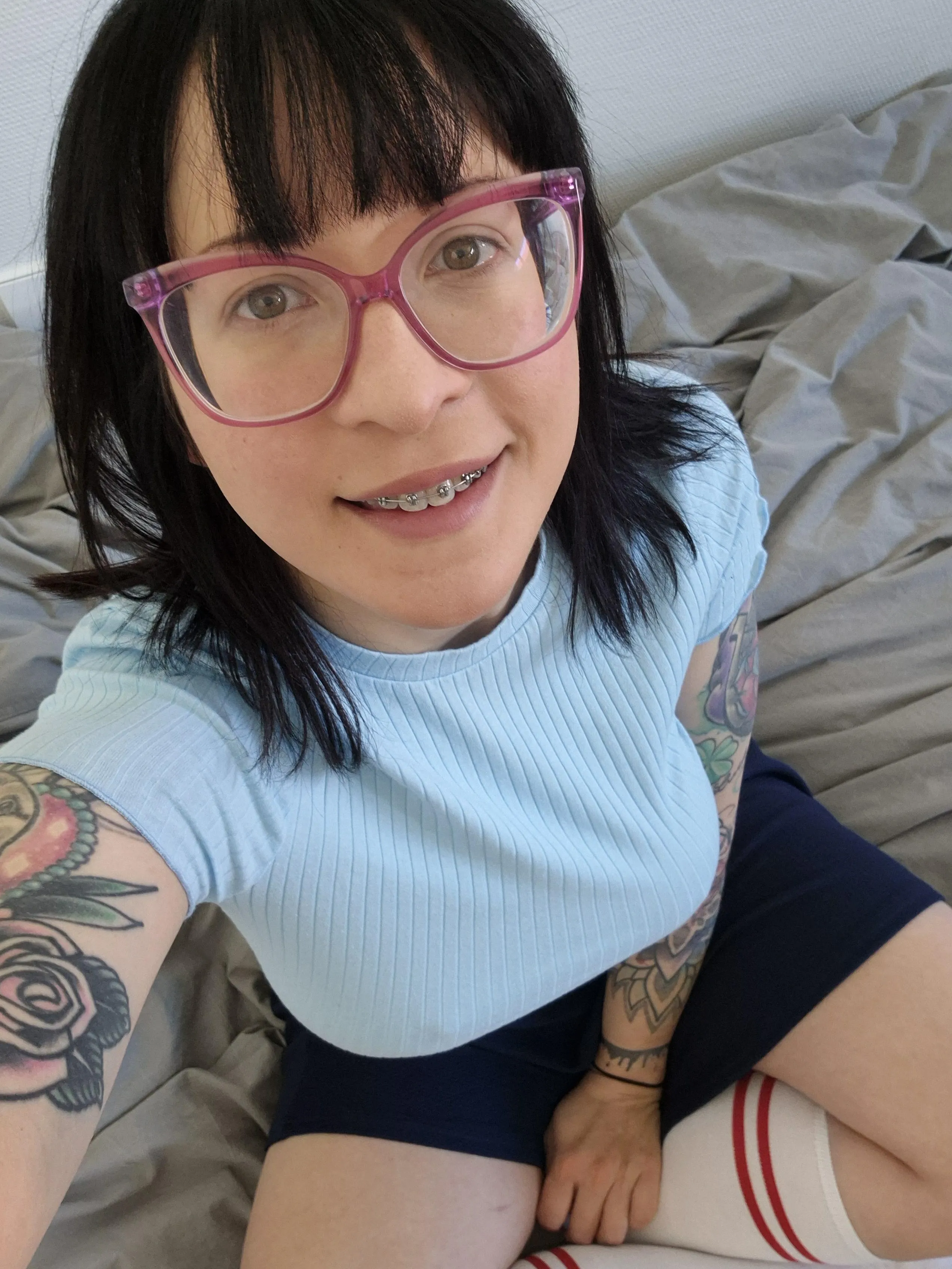 Braces and glasses aaaand big boobs