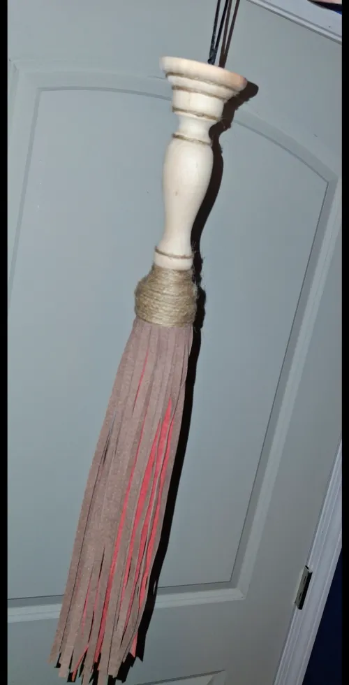 My first flogger. Made of tassles, a candlestick holder, and twine for wrapping.