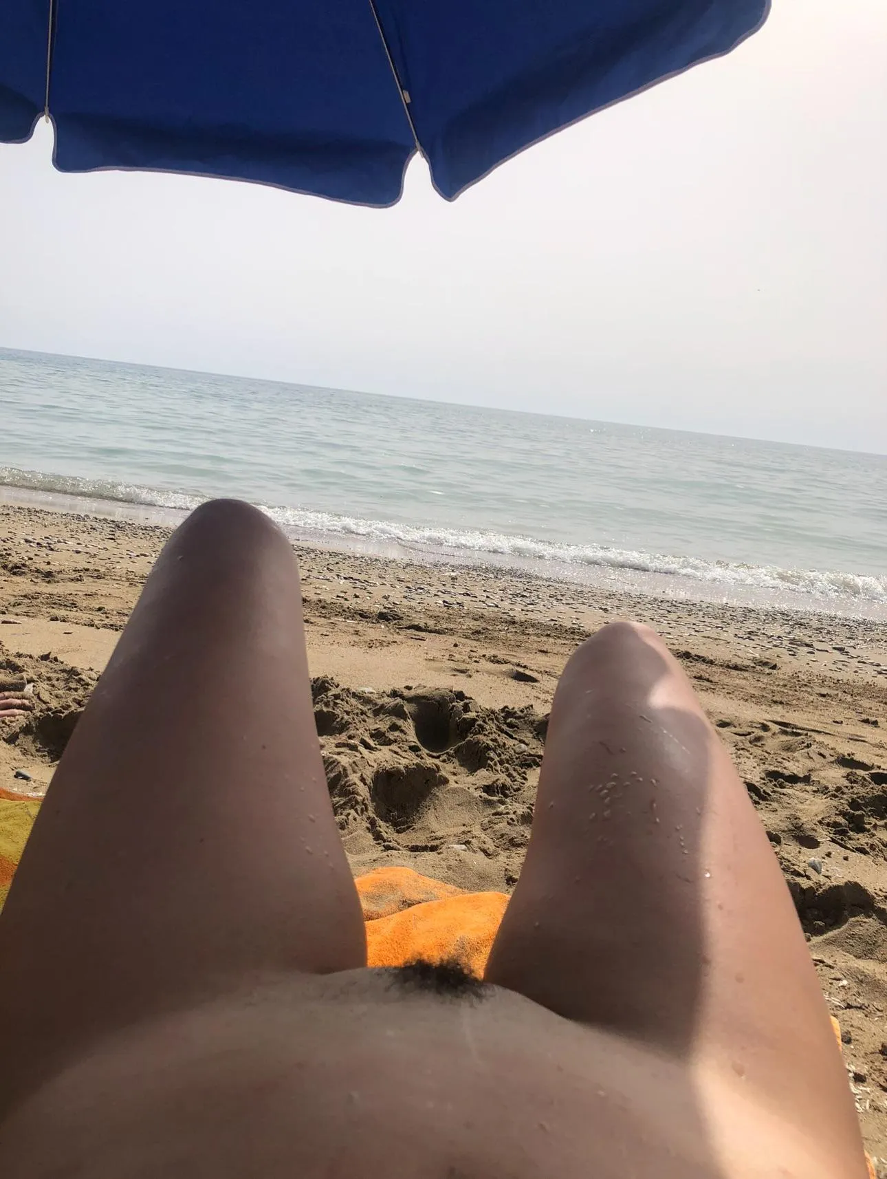 Alone and nude on the beach.
