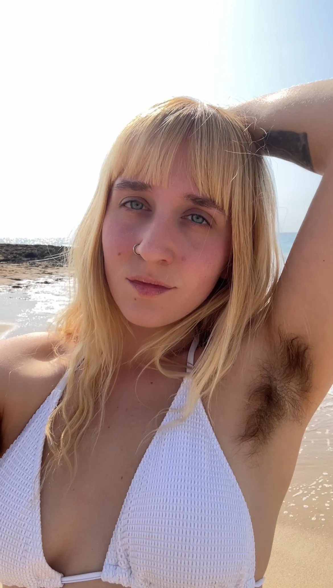Hairy armpits by the sea