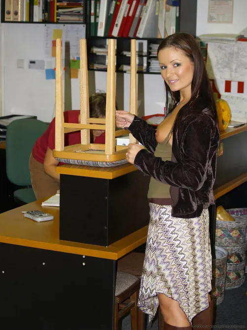 Scenes from AltBoobWorld : This lady is buying a stool from a used furniture warehouse.  There's many bargains to be found here!