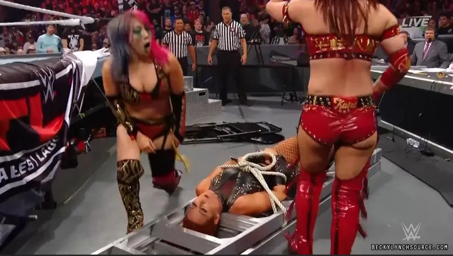 Becky Lynch tied up by the Kabuki Warriors