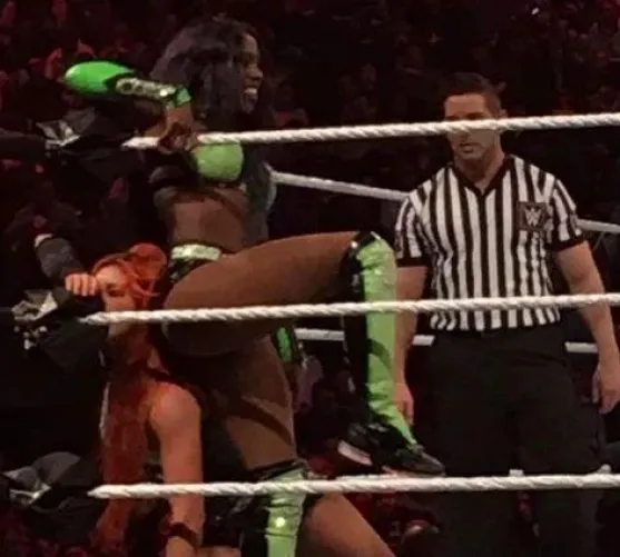 Naomi using Becky Lynch as a seat
