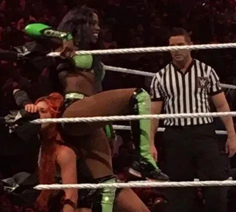 Naomi using Becky Lynch as a seat