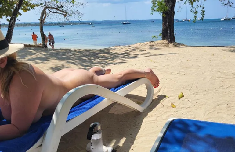 Getting naked on the beach...gotta love the third pic, guys from other resorts tend to paddleboard back and forth on our beach to be a voyeur LOL He got a nice view :)