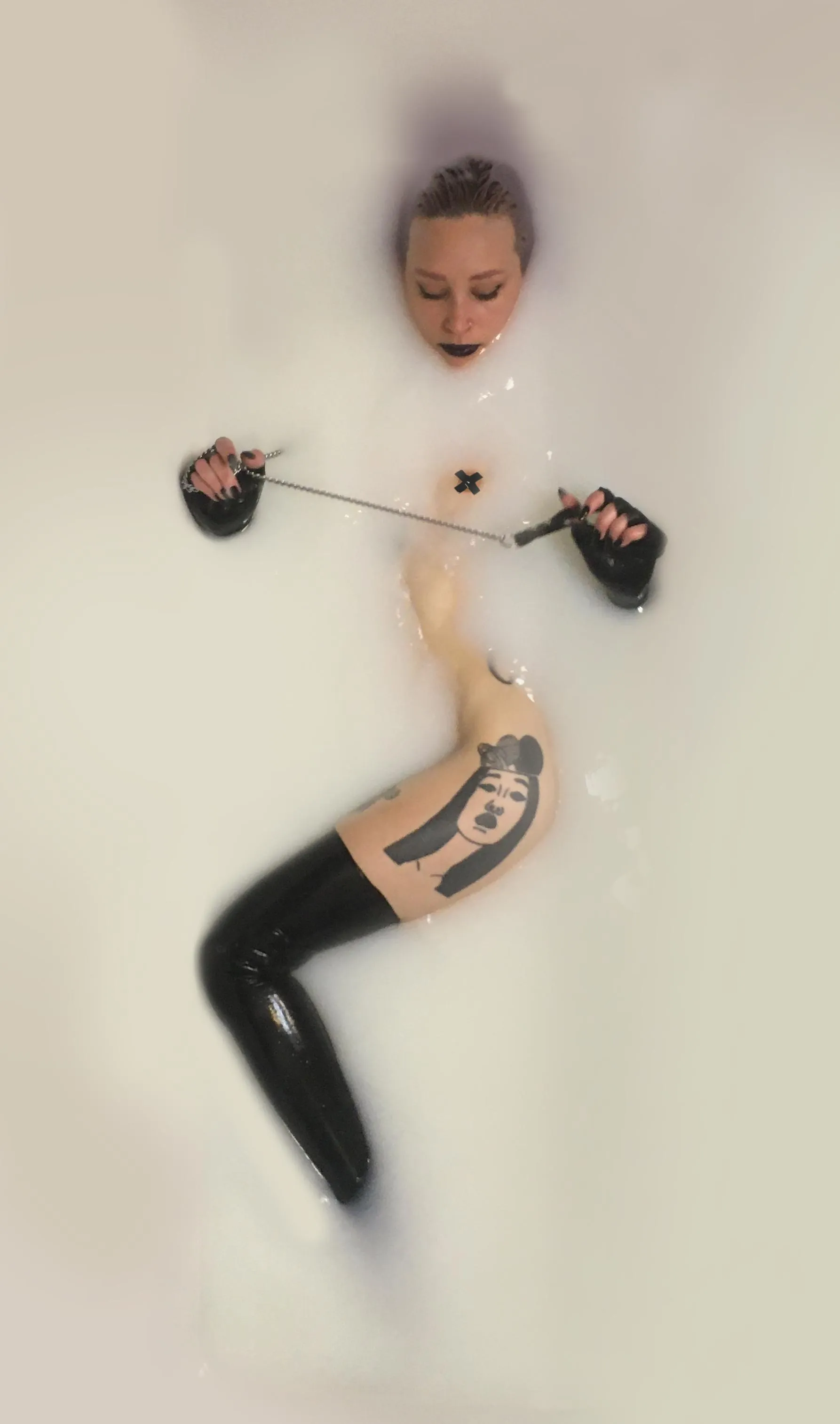 Wearing fingerless latex gloves in my cum bath!
