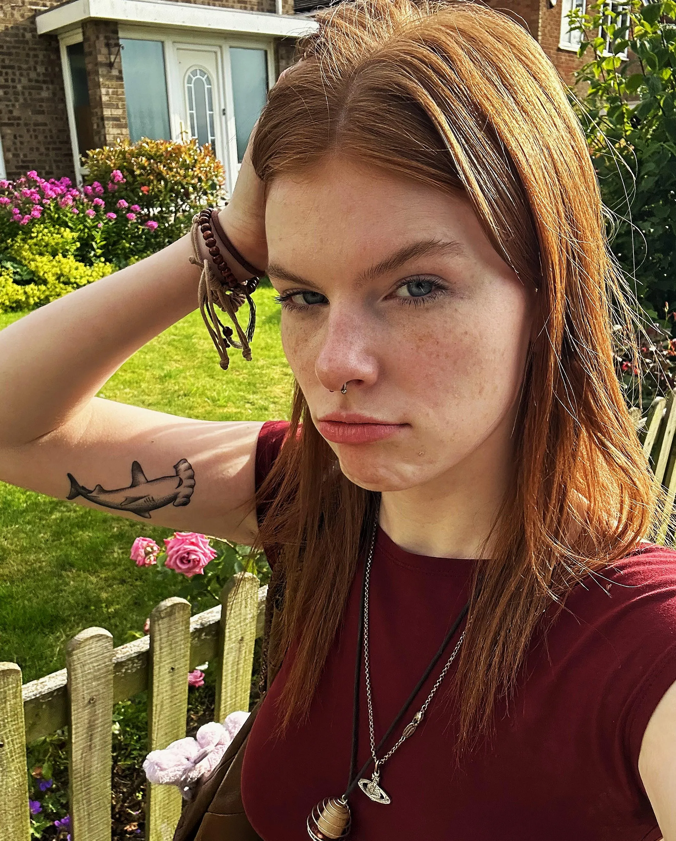 Fiery hair and inked skin—dangerously irresistible. Who’s up for a closer look?